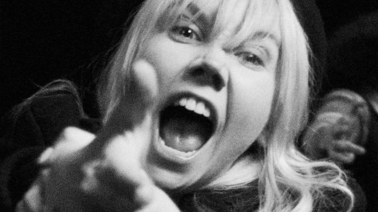 A Woman Walks Into A Bankの背景画像