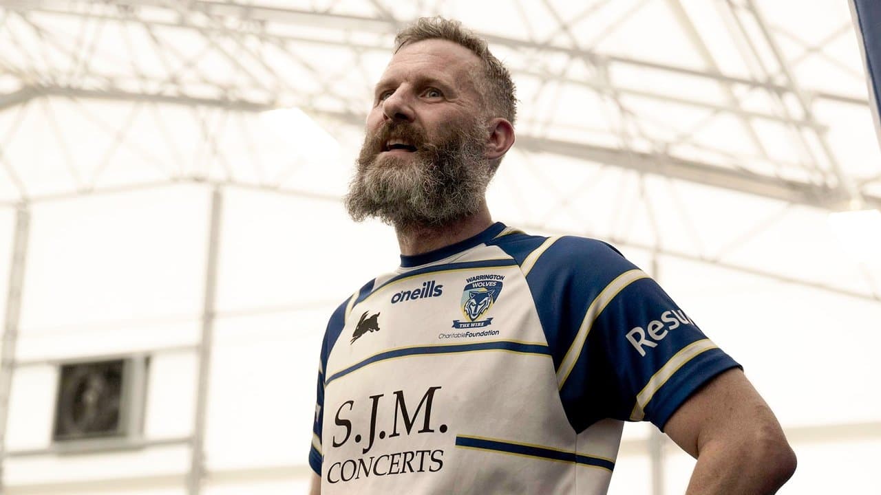 Adam Hills: Take His Legsの背景画像