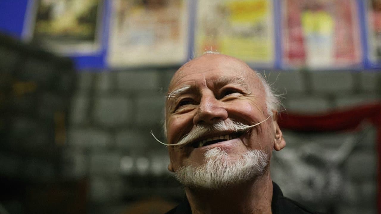 The Wild World of Ted V. Mikelsの背景画像